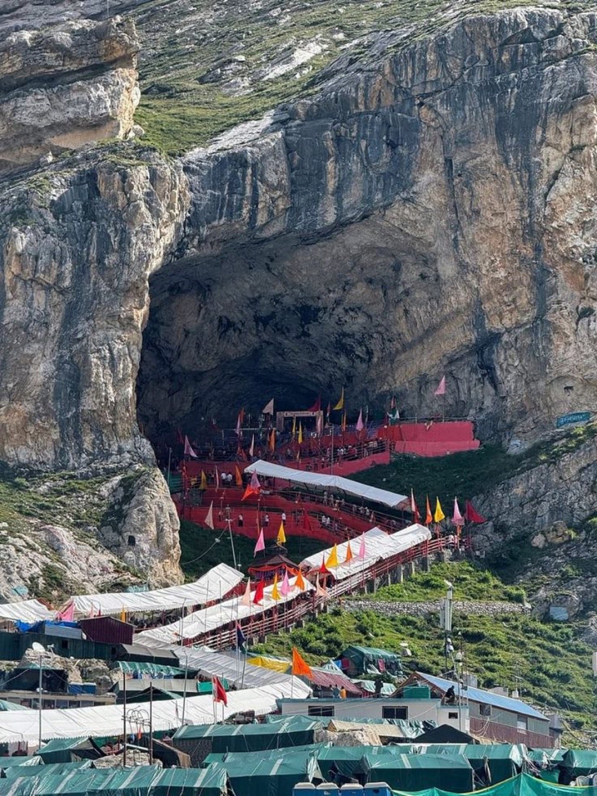 Amarnath Cave with pilgrims approaching during yatra season