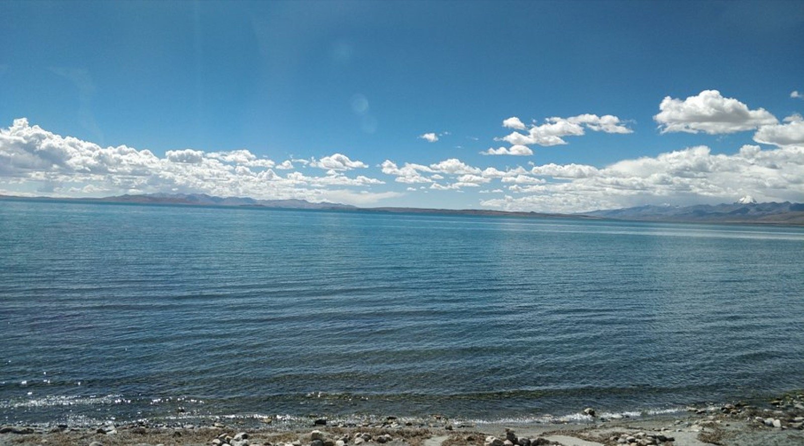 Lake Mansarovar with snow peaks reflected